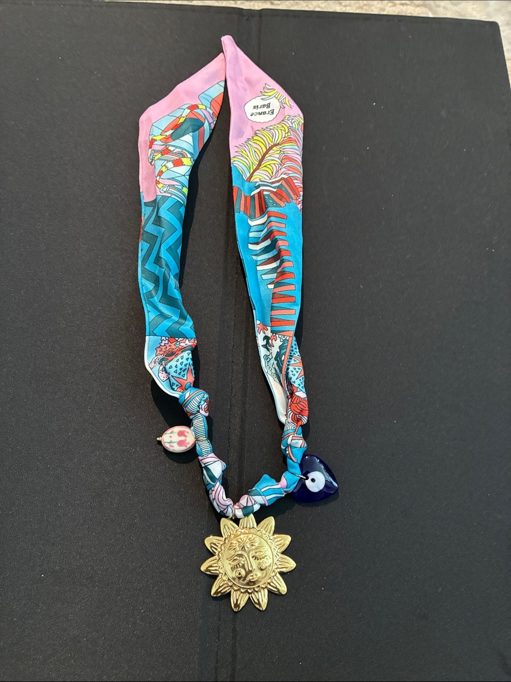 Fashion Jewelry Pink & Blue Patterned Scarf Necklace with Gold Sun Pendant